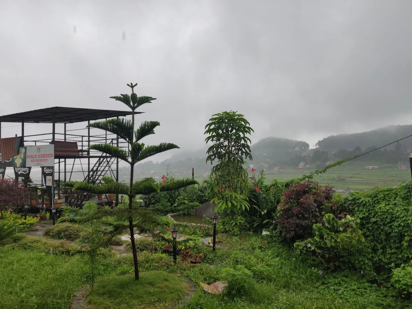 Panoramic landscape view from Peace Garden Restaurant overlooking Godawari hills